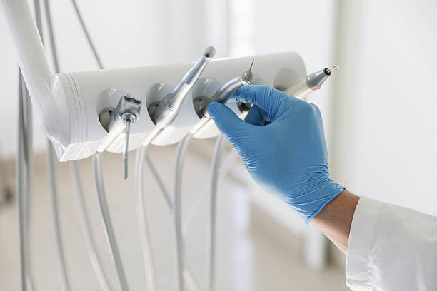 Professional Tooth Extraction technician working in Broussard, LA